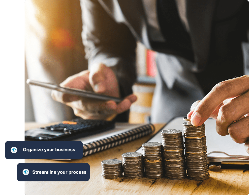 Accountant stacking coins and calculating