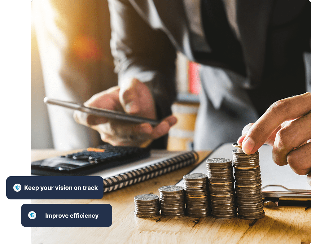 Accountant stacking coins and calculating