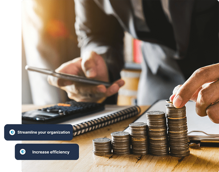 Accountant stacking coins and calculating