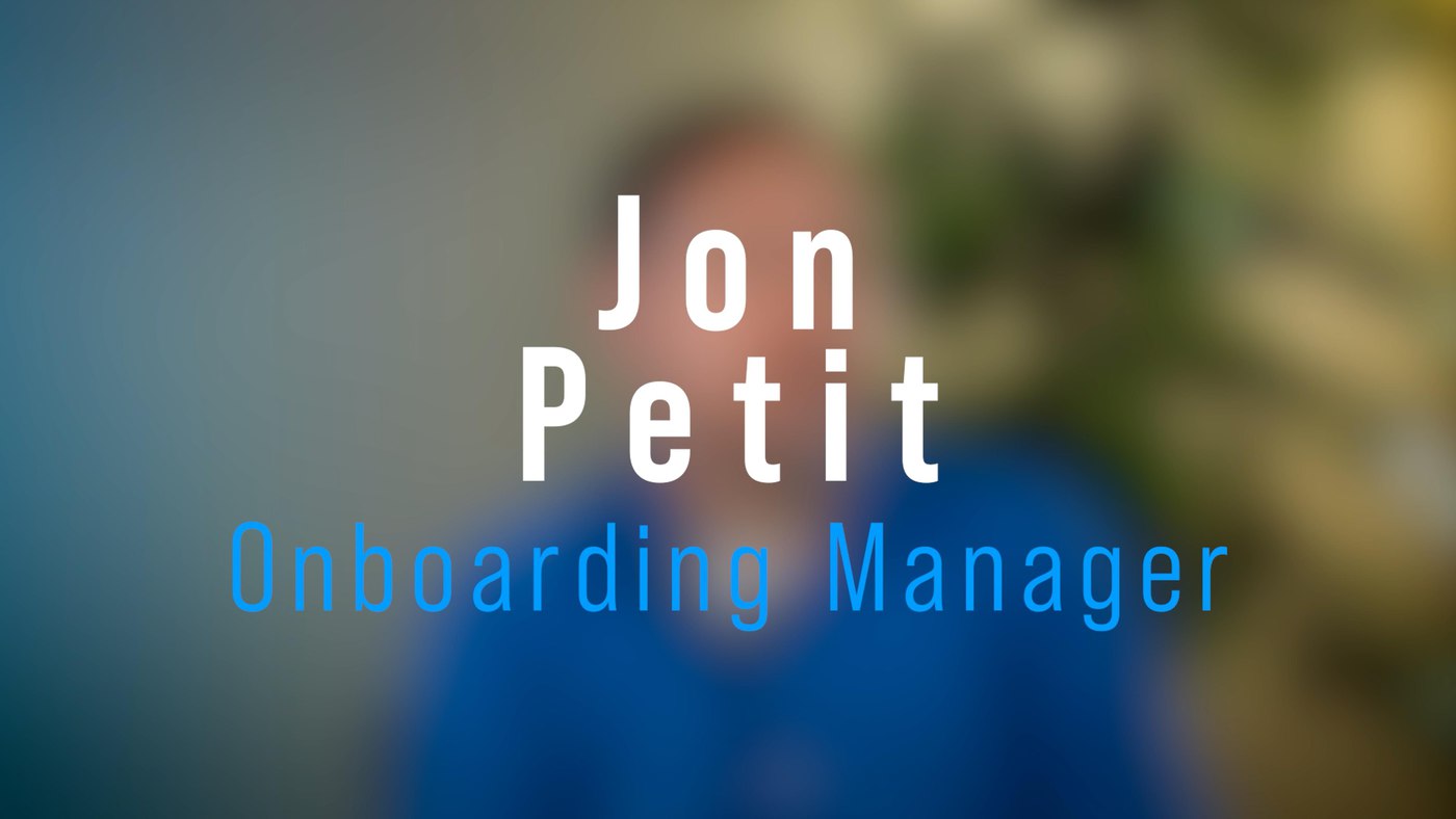 Text with employee name and job title over blurred background