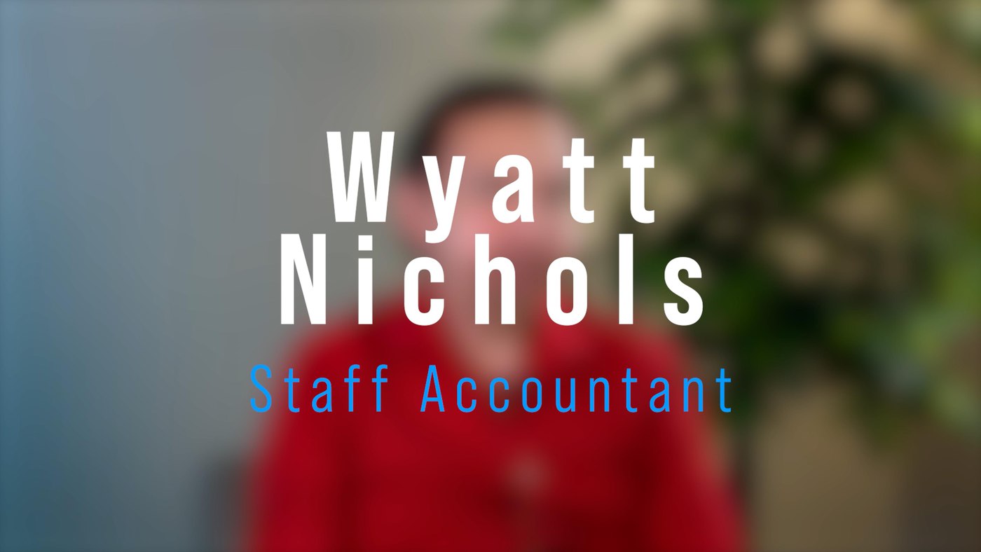 Text with employee name and job title over blurred background