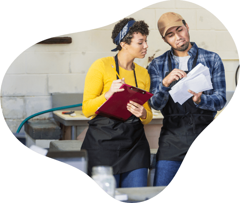 two people reviewing papers